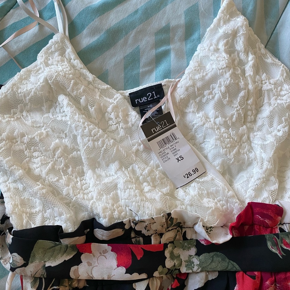 Floral black and white romper from Rue 21 .